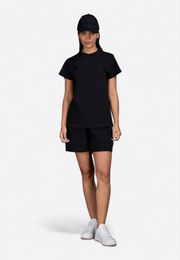 Model wearing black signature cap, front view – East Vibe